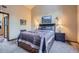 A comfy bedroom features a queen bed, soft carpeting, and ambient lighting at 748 Ridgeside Dr, Golden, CO 80401