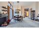 Bright open living space featuring modern lighting, a fireplace, and an adjacent dining area at 748 Ridgeside Dr, Golden, CO 80401