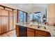 Kitchen with a large granite island, wooden cabinets, and stainless steel appliances at 748 Ridgeside Dr, Golden, CO 80401