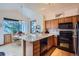 Kitchen features granite countertops, stainless steel appliances, and a breakfast nook with natural light at 748 Ridgeside Dr, Golden, CO 80401