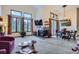 Bright living space with a fireplace, large windows, and an adjacent dining area at 748 Ridgeside Dr, Golden, CO 80401