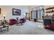 A bright living room with large windows, a fireplace, and comfortable seating at 748 Ridgeside Dr, Golden, CO 80401