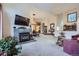 Spacious living room with a fireplace, a flat-screen TV, and open layout at 748 Ridgeside Dr, Golden, CO 80401