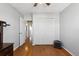 The bright bedroom has a closet and light-colored walls, with wood floors, enhancing the sense of space at 1009 Milky Way, Thornton, CO 80260