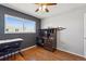 Bedroom with wood floors, ceiling fan, and a desk and hutch offering a functional and appealing space at 1009 Milky Way, Thornton, CO 80260