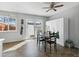 Cozy dining area with a wooden table set, natural light from sliding door, and storage cabinet nearby at 1009 Milky Way, Thornton, CO 80260