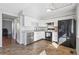 Modern kitchen with white cabinets, stainless steel dishwasher, and a black refrigerator at 1009 Milky Way, Thornton, CO 80260