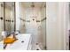 Stylish bathroom featuring a glass shower with decorative tiling and modern sink for a clean, luxurious look at 124 N Marion St, Denver, CO 80218