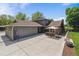 Large backyard with patio and ample space for activities at 7359 S Jay St, Littleton, CO 80128