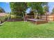 Spacious backyard with a built-in trampoline and a swing set at 7359 S Jay St, Littleton, CO 80128