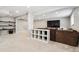 Finished basement provides a spacious and open layout, with shelving and carpet, ideal for flexible living arrangements at 7359 S Jay St, Littleton, CO 80128