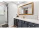Bathroom features a vanity with a mirror, a shower, and great natural light at 7359 S Jay St, Littleton, CO 80128