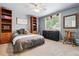 Bedroom featuring ceiling fan, carpeted floors, and organizational furniture at 7359 S Jay St, Littleton, CO 80128
