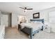 Bedroom featuring ceiling fan, carpeted floor, bright natural light, and furniture at 7359 S Jay St, Littleton, CO 80128