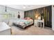 Bedroom features a guitar, textured wall and carpeted floors at 7359 S Jay St, Littleton, CO 80128