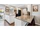 Charming kitchen featuring granite countertops, open shelves and black appliances at 7359 S Jay St, Littleton, CO 80128