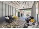 Outdoor patio with a cozy seating area, offering a seamless transition to the backyard and outdoor amenities at 7359 S Jay St, Littleton, CO 80128