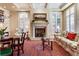 Spacious living room with fireplace, built-in shelving, and large windows at 87 S Ash, Denver, CO 80246