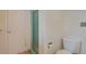 Cozy bathroom with a glass door shower and a toilet at 2309 E Floyd Pl, Englewood, CO 80113