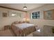 Serene bedroom with a cozy bed, a window with shutters, and ambient lighting at 2309 E Floyd Pl, Englewood, CO 80113
