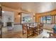 Dining room featuring decorative tin ceiling and an open view to kitchen and living room at 2309 E Floyd Pl, Englewood, CO 80113