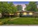 Charming single-story home with a well-manicured lawn and inviting walkway at 2309 E Floyd Pl, Englewood, CO 80113
