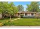 Charming single-story home with a well-manicured lawn and inviting walkway at 2309 E Floyd Pl, Englewood, CO 80113