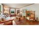 Inviting living room featuring a fireplace, hardwood floors, and comfortable seating at 2309 E Floyd Pl, Englewood, CO 80113