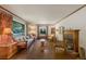 Cozy living room featuring a fireplace, hardwood floors, and comfortable seating at 2309 E Floyd Pl, Englewood, CO 80113