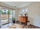 Bedroom with hardwood floors, vintage dresser, and sliding glass door at 2592 Sweet Wind Ave, Castle Rock, CO 80109