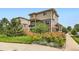 Two-story home featuring charming wood siding, and a lush front yard at 2592 Sweet Wind Ave, Castle Rock, CO 80109