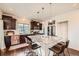 Kitchen featuring granite counters, stainless appliances, and an island with seating at 2592 Sweet Wind Ave, Castle Rock, CO 80109