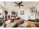 Open-concept living room with hardwood floors and an open view of the kitchen and staircase at 2592 Sweet Wind Ave, Castle Rock, CO 80109