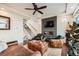 Living room showcasing modern decor, fireplace and an open staircase at 2592 Sweet Wind Ave, Castle Rock, CO 80109