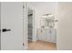Stylish bathroom with double sinks, decorative mirror and marble-look tiled shower at 3141 S Tamarac Dr # 111G, Denver, CO 80231