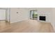 Spacious living room with a fireplace and sliding glass doors to the outside at 3141 S Tamarac Dr # 111G, Denver, CO 80231