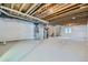 Unfinished basement with exposed wood beams and ductwork, providing ample storage space at 14144 Bunny Hop Ln, Parker, CO 80134