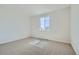 Bedroom featuring carpet, white walls, trim, and a window with neighborhood views at 14144 Bunny Hop Ln, Parker, CO 80134