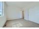 Bedroom featuring carpet, white walls and trim, a window, and a closet at 14144 Bunny Hop Ln, Parker, CO 80134