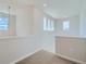 Bright upstairs hallway featuring neutral carpeting and natural light from multiple windows at 14144 Bunny Hop Ln, Parker, CO 80134