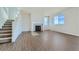 Bright living room boasts a fireplace, large windows, and modern vinyl flooring at 14144 Bunny Hop Ln, Parker, CO 80134