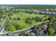 Aerial view of lush green park surrounded by a neighborhood, showcasing the community's green space at 3884 S Niagara Way, Denver, CO 80237
