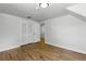Finished attic room with hardwood floors and is ready to be transformed at 3884 S Niagara Way, Denver, CO 80237