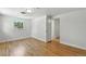 Attic room with hardwood floors, built in window, and natural light at 3884 S Niagara Way, Denver, CO 80237