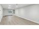 Spacious basement with laminate flooring, bright recessed lighting, and a window well at 3884 S Niagara Way, Denver, CO 80237