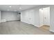 Finished basement featuring a laminate floor, recessed lighting and access to multiple rooms at 3884 S Niagara Way, Denver, CO 80237