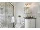 Modern bathroom featuring subway tile shower, updated fixtures, and contemporary vanity at 3884 S Niagara Way, Denver, CO 80237