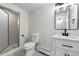 Modern bathroom with a glass-enclosed shower, sleek vanity, and a contemporary design at 3884 S Niagara Way, Denver, CO 80237