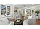 Open concept living area featuring tile flooring, natural light and adjoined dining room space at 3884 S Niagara Way, Denver, CO 80237