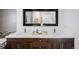 Elegant bathroom with double sinks, modern fixtures, and sleek vanity with ample counter space at 1265 Niagara St, Denver, CO 80220